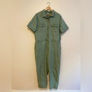Olive green jumpsuit, workwear-inspired, boiler suit